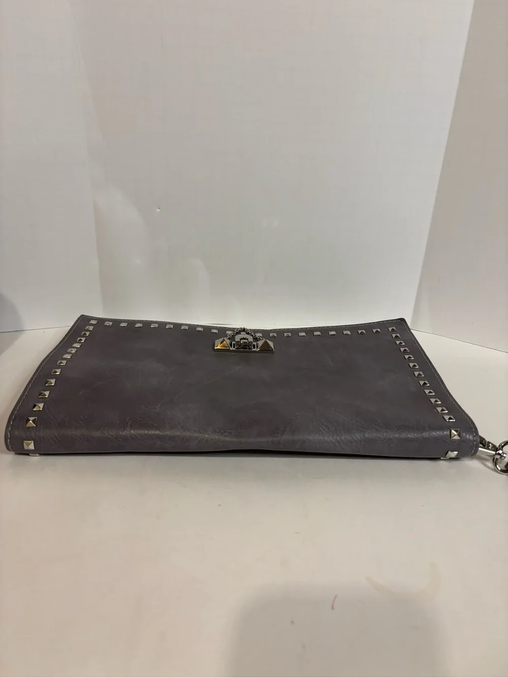Stud-Trim Gray Wristlet Clutch